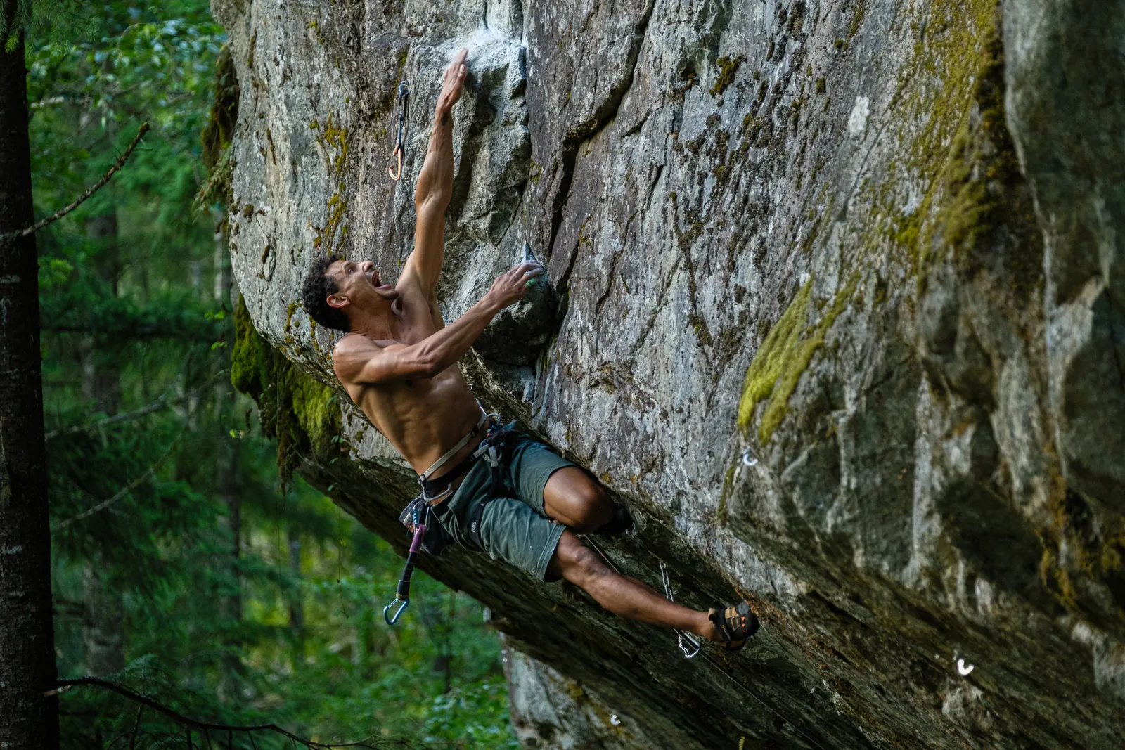 Bouldering at one of Squamish's granite boulderfields with mountain backdrop
